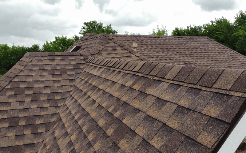 New architectural shingle roof with ridge vent and clean flashing
